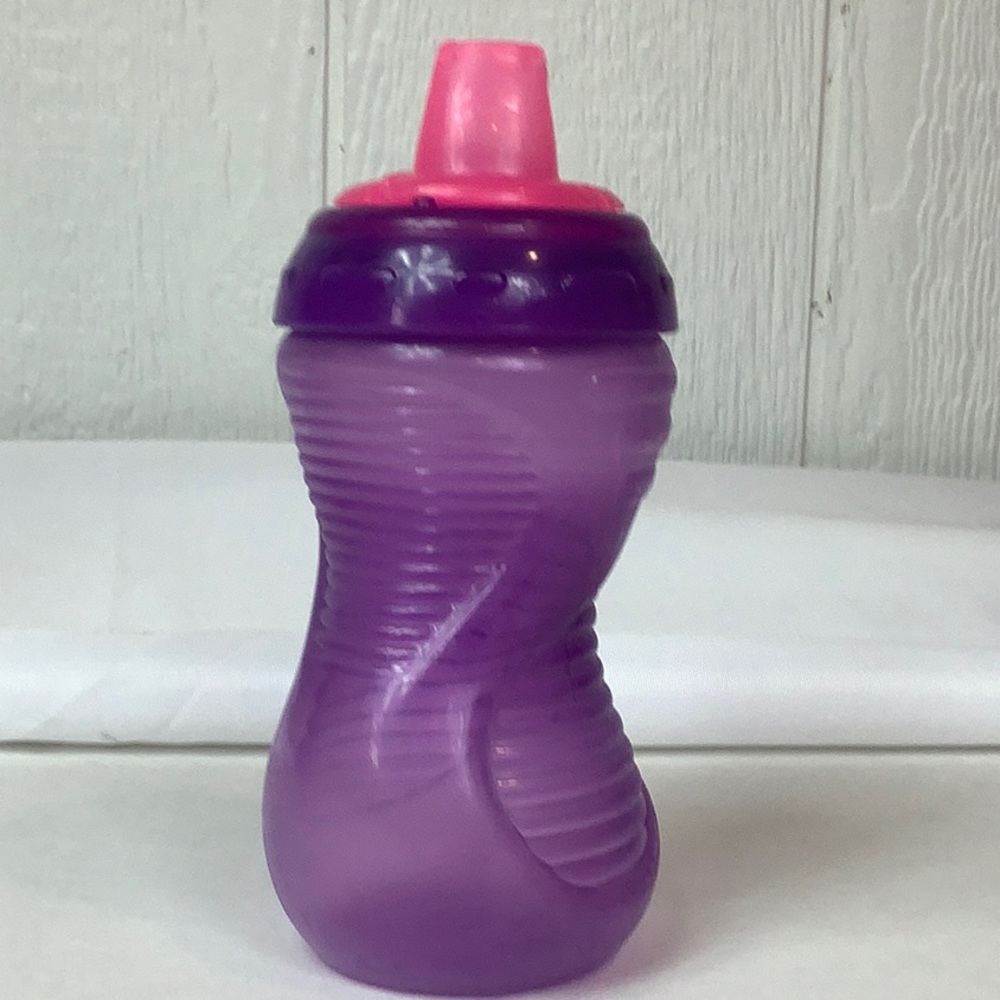 Munchkin’s pink and purple sippy cup